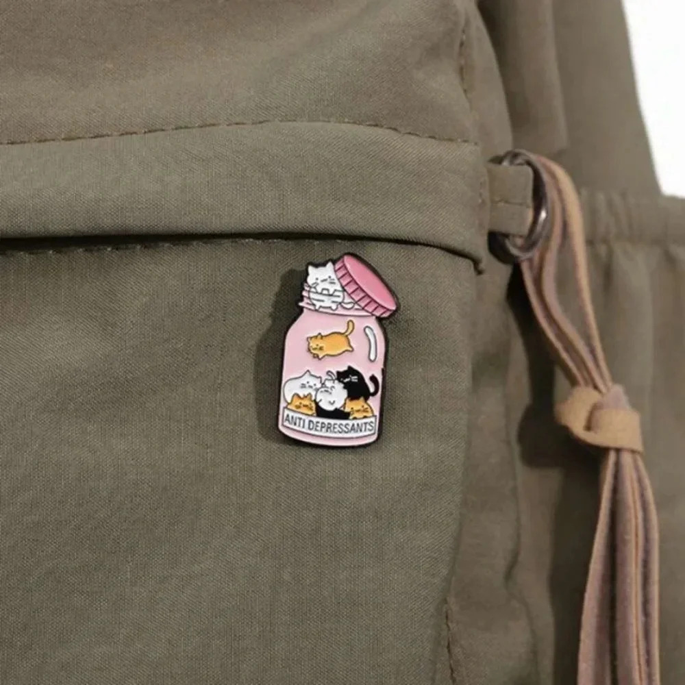 Pink multicolor kitty cats in medicine bottle antidepressants enamel pin bag hat